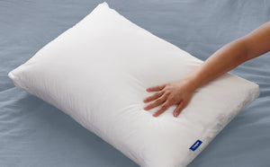 A hand feeling the Casper® 金刚KINGKONG游戏官网 Original Pillow